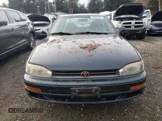 1994 Toyota Camry XLE with VIN JT2GK13E2R0008225, listed as a Copart auction lot 83668084 with 258,735 mi miles and Salvage Title. Bid and sale history available at carsss.com. Image 5.