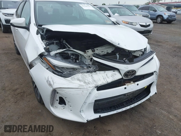 2017 Toyota Corolla L z VIN 2T1BURHE8HC787010, wystawiony jako IAAI lot #42366723 z przebiegiem 104 805 mil mil oraz . Historia ofert i sprzedaży dostępna na DreamBid. Obrazek 6.