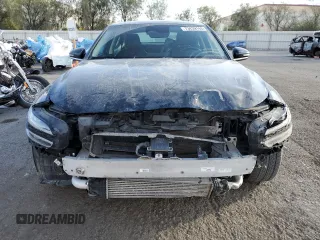 2022 Genesis G70 2.0T with VIN KMTG34TA2NU094241, listed as a Copart auction lot 73439144 with 52,352 mi miles and Salvage Title. Bid and sale history available at carsss.com. Image 5.