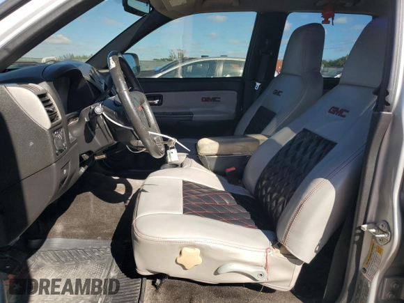 2012 GMC Canyon SLE1 with VIN 1GTD5MFE9C8108474, listed as a Copart auction lot 82650124 with 219,772 mi miles and Salvage Title. Bid and sale history available at carsss.com. Image 7.