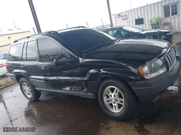 2004 Jeep Grand Cherokee Laredo with VIN 1J4GX48N94C435700, listed as a IAAI auction lot 41809624 with 147,413 mi miles. Bid and sale history available at carsss.com. Image 13.