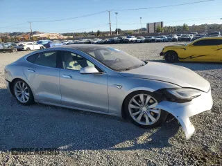 2016 Tesla Model S 90D with VIN 5YJSA1E26GF147974, listed as a Copart auction lot 82815404 with 126,609 mi miles and Salvage Title. Bid and sale history available at DreamBid. Image 4.