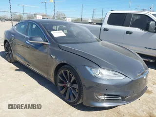 2015 Tesla Model S 85D with VIN 5YJSA1E41FF111920, listed as a IAAI auction lot 41733942 with 86,217 mi miles. Bid and sale history available at carsss.com. Image 1.
