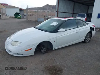 2002 Saturn SC with VIN 1G8ZR12762Z212309, listed as a IAAI auction lot 41857740 with 204,209 mi miles. Bid and sale history available at carsss.com. Image 2.