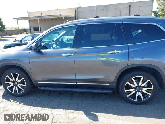 2021 Honda Pilot Touring 8-Passenger with VIN 5FNYF6H97MB034399, listed as a IAAI auction lot 42303419 with 50,034 mi miles and . Bid and sale history available at DreamBid. Image 15.