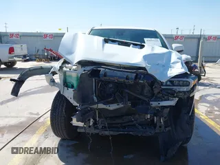 2023 Toyota Tacoma SR z VIN 3TYRZ5CN5PT034397, wystawiony jako IAAI lot #42055222 z przebiegiem 39 144 mil mil oraz . Historia ofert i sprzedaży dostępna na DreamBid. Obrazek 13.