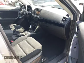 2014 Mazda CX-5 Touring z VIN JM3KE2CYXE0322943, wystawiony jako IAAI lot #41934670 z przebiegiem 110 690 mil mil oraz . Historia ofert i sprzedaży dostępna na DreamBid. Obrazek 5.