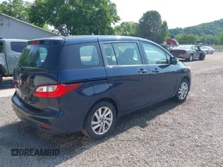2015 Mazda 5 Sport z VIN JM1CW2BL9F0187973, wystawiony jako IAAI lot #42378711 z przebiegiem 97 543 mil mil oraz . Historia ofert i sprzedaży dostępna na DreamBid. Obrazek 4.