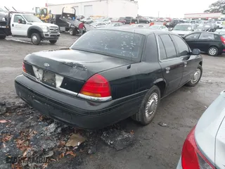 1999 Ford Crown Victoria Police Pkg with VIN 2FAFP71W3XX130521, listed as a IAAI auction lot 41384939 with 257,504 mi miles. Bid and sale history available at carsss.com. Image 4.