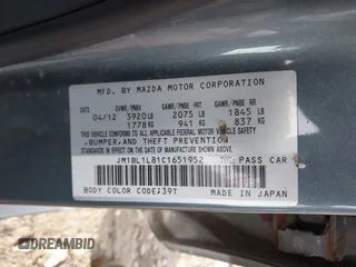 2012 Mazda Mazda3 i Touring with VIN JM1BL1L81C1651952, listed as a IAAI auction lot 40863599 with 242,296 mi miles. Bid and sale history available at carsss.com. Image 9.