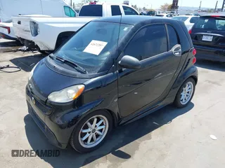 2014 Smart fortwo Pure with VIN WMEEJ3BA1EK752202, listed as a IAAI auction lot 42672207 with 65,736 mi miles and . Bid and sale history available at DreamBid. Image 2.