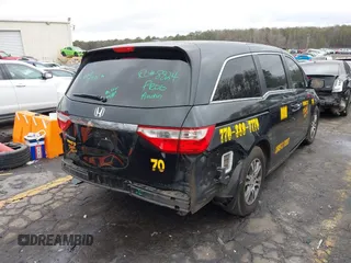 2012 Honda Odyssey EX-L with VIN 5FNRL5H64CB142247, listed as a IAAI auction lot 41722015 with 179,637 mi miles and . Bid and sale history available at carsss.com. Image 4.