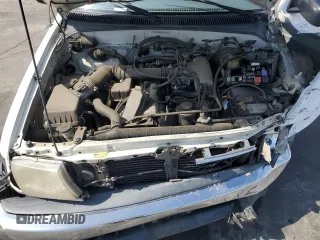 1999 Toyota Tacoma z VIN 4TAVL52N7XZ567598, wystawiony jako Copart lot #55141495 z przebiegiem 225 505 mil mil oraz Szkoda całkowita • Salvage title. Historia ofert i sprzedaży dostępna na DreamBid. Obrazek 11.