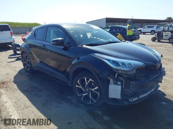2020 Toyota C-HR LE with VIN JTNKHMBX9L1063563, listed as a IAAI auction lot 41986457 with 143,694 mi miles. Bid and sale history available at carsss.com. Image 1.