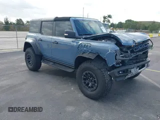 2023 Ford Bronco Raptor z VIN 1FMEE5JR6PLB05714, wystawiony jako IAAI lot #41905036 z przebiegiem 6 115 mil mil oraz . Historia ofert i sprzedaży dostępna na DreamBid. Obrazek 1.