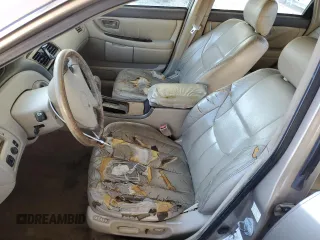 2000 Toyota Avalon XL z VIN 4T1BF28B2YU079163, wystawiony jako Copart lot #50129935 z przebiegiem 311 916 mil mil oraz Nie do naprawy • Non repairable. Historia ofert i sprzedaży dostępna na DreamBid. Obrazek 7.