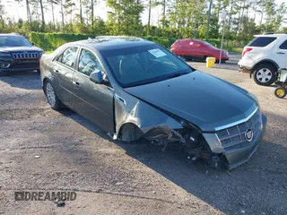 2011 Cadillac CTS Luxury with VIN 1G6DE5EY5B0154563, listed as a IAAI auction lot 36806985 with 92,635 mi miles and . Bid and sale history available at DreamBid. Image 1.