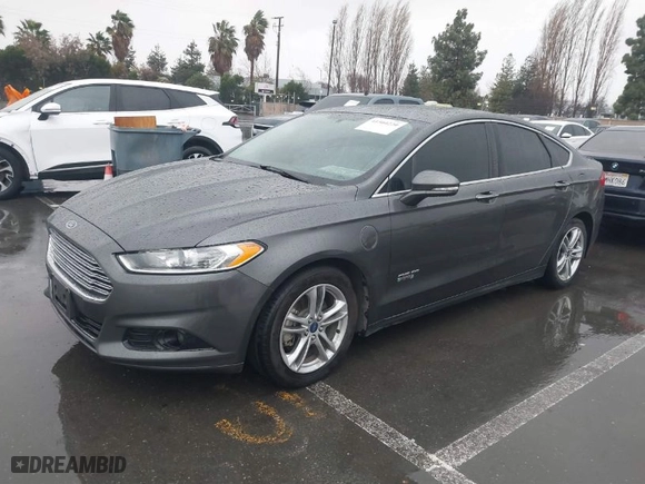 2015 Ford Fusion Energi Titanium with VIN 3FA6P0SU2FR173958, listed as a IAAI auction lot 41504220 with 170,235 mi miles. Bid and sale history available at carsss.com. Image 2.