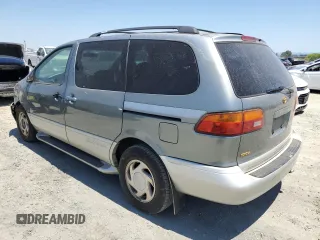 1998 Toyota Sienna LE with VIN 4T3ZF13C4WU064791, listed as a Copart auction lot 61411865 with 218,835 mi miles and Salvage title. Bid and sale history available at DreamBid. Image 2.