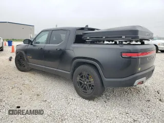 2022 Rivian R1T Adventure z VIN 7FCTGAAA5NN015734, wystawiony jako Copart lot #44019715 z przebiegiem 27 542 mil mil oraz Szkody całkowita. Historia ofert i sprzedaży dostępna na DreamBid. Obrazek 2.