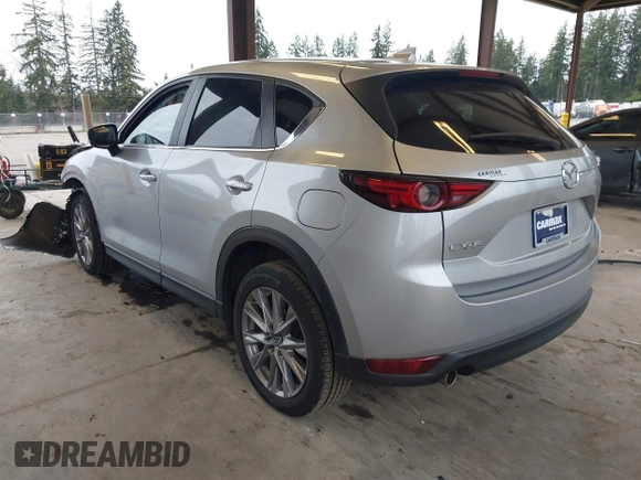2020 Mazda CX-5 Grand Touring with VIN JM3KFADM0L0738693, listed as a IAAI auction lot 41725906 with 63,629 mi miles. Bid and sale history available at carsss.com. Image 3.