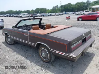 1982 Chrysler LeBaron z VIN 1C3BC55D2CG145033, wystawiony jako IAAI lot #42145500 z przebiegiem 20 643 mil mil oraz . Historia ofert i sprzedaży dostępna na DreamBid. Obrazek 3.