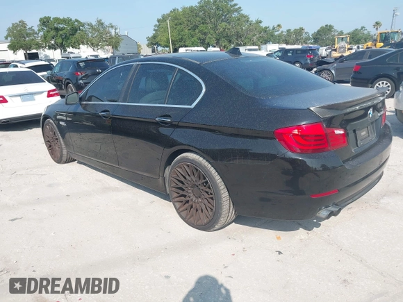2012 BMW 5 Series 528i with VIN WBAXG5C58CDX05153, listed as a IAAI auction lot 42196906 with 120,652 mi miles. Bid and sale history available at carsss.com. Image 3.