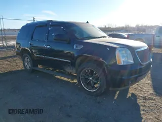 2013 GMC Yukon Denali with VIN 1GKS2EEF7DR310276, listed as a IAAI auction lot 41432983 with 243,119 mi miles. Bid and sale history available at carsss.com. Image 1.