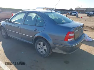 2004 Volkswagen Jetta GL z VIN 3VWRA69M64M044291, wystawiony jako IAAI lot #41882666 z przebiegiem 205 029 mil mil oraz . Historia ofert i sprzedaży dostępna na DreamBid. Obrazek 3.