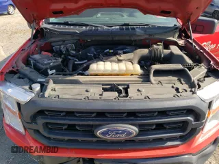2021 Ford F-150 XL z VIN 1FTMF1CP3MKD82677, wystawiony jako Copart lot #82826014 z przebiegiem 98 441 mil mil oraz Szkoda całkowita • Salvage title. Historia ofert i sprzedaży dostępna na DreamBid. Obrazek 11.