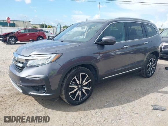 2022 Honda Pilot Elite with VIN 5FNYF6H04NB025212, listed as a IAAI auction lot 42430032 with 69,427 mi miles and . Bid and sale history available at DreamBid. Image 2.