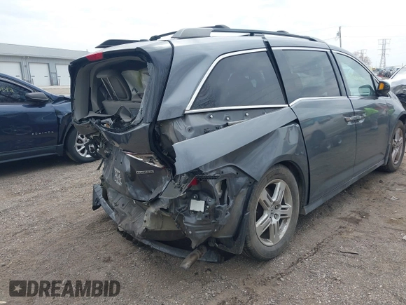 2012 Honda Odyssey Touring with VIN 5FNRL5H99CB028304, listed as a IAAI auction lot 42031916 with 216,185 mi miles and . Bid and sale history available at DreamBid. Image 6.