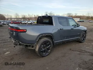 2023 Rivian R1T Adventure z VIN 7FCTGBAA8PN028065, wystawiony jako Copart lot #81941474 z przebiegiem 16 060 mil mil oraz Szkoda całkowita • Salvage title. Historia ofert i sprzedaży dostępna na DreamBid. Obrazek 3.