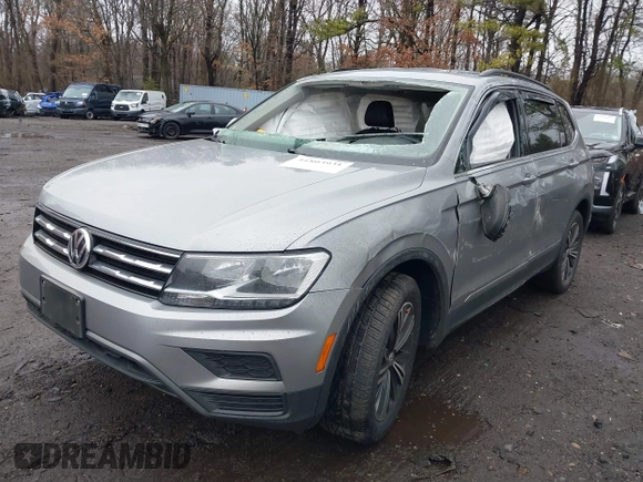 2021 Volkswagen Tiguan SE with VIN 3VV2B7AX8MM100651, listed as a IAAI auction lot 41803931 with 69,405 mi miles and . Bid and sale history available at DreamBid. Image 2.