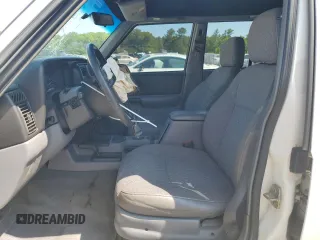 1998 Jeep Cherokee Sport with VIN 1J4FJ68S8WL116368, listed as a Copart auction lot 59228735 with 113,546 mi miles and Salvage title. Bid and sale history available at DreamBid. Image 7.