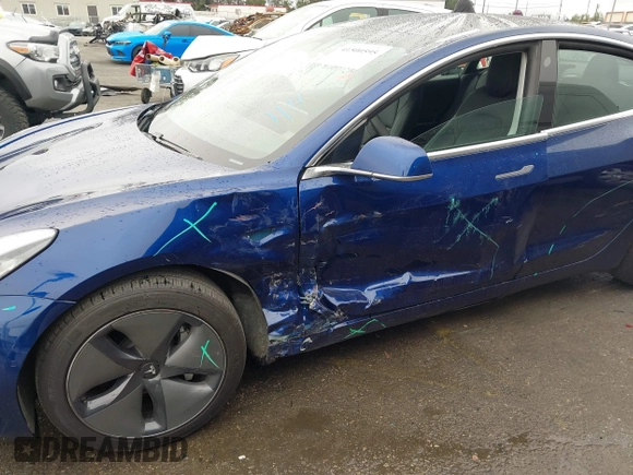 2020 Tesla Model 3 Standard Range Plus with VIN 5YJ3E1EAXLF644679, listed as a IAAI auction lot 41500595 with 53,726 mi miles and . Bid and sale history available at DreamBid. Image 6.