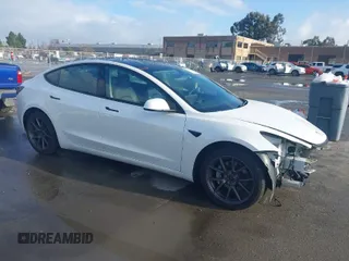 2021 Tesla Model 3 Long Range with VIN 5YJ3E1EB9MF055990, listed as a IAAI auction lot 41584065 with 49,147 mi miles. Bid and sale history available at carsss.com. Image 1.