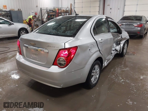 2014 Chevrolet Sonic LT with VIN 1G1JC5SG8E4107664, listed as a IAAI auction lot 41614306 with 128,946 mi miles and . Bid and sale history available at DreamBid. Image 4.