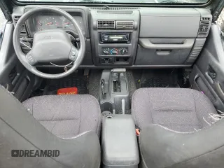 2002 Jeep Wrangler Sport with VIN 1J4FA49S12P730135, listed as a Copart auction lot 54477835 with 148,153 mi miles and Salvage title. Bid and sale history available at DreamBid. Image 8.