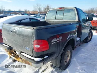 1997 Ford F-150 XL with VIN 1FTDF08W5VKD47103, listed as a IAAI auction lot 41345739 with 209,732 mi miles. Bid and sale history available at carsss.com. Image 4.
