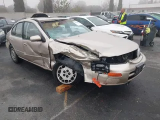 1995 Nissan Maxima GLE z VIN JN1CA21DXST075946, wystawiony jako IAAI lot #41669451 z przebiegiem 154 423 mil mil oraz . Historia ofert i sprzedaży dostępna na DreamBid. Obrazek 1.