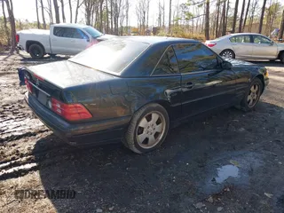 1999 Mercedes-Benz SL-Class with VIN WDBFA68F9XF187036, listed as a IAAI auction lot 41542221 with 114,602 mi miles. Bid and sale history available at carsss.com. Image 4.