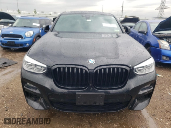 2021 BMW X4 M40i with VIN 5UX2V5C00M9H95699, listed as a Copart auction lot 63564433 with 33,500 mi miles and Salvage title. Bid and sale history available at DreamBid. Image 5.