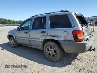 2000 Jeep Grand Cherokee Laredo with VIN 1J4G248S7YC321298, listed as a Copart auction lot 58036255 with 292,779 mi miles and Salvage title. Bid and sale history available at DreamBid. Image 2.