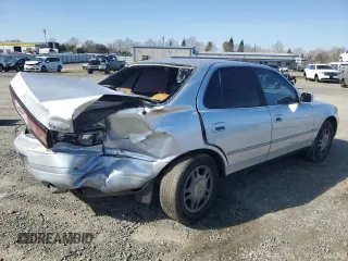 1994 Toyota Camry XLE with VIN JT2GK13EXR0004262, listed as a Copart auction lot 46285135 with 191,548 mi miles and Salvage Title. Bid and sale history available at carsss.com. Image 3.