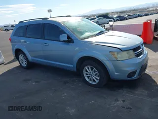 2013 Dodge Journey SXT with VIN 3C4PDCBG4DT584135, listed as a IAAI auction lot 41902149 with 165,700 mi miles and . Bid and sale history available at carsss.com. Image 1.
