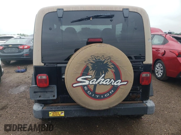2000 Jeep Wrangler Sahara z VIN 1J4FA59S2YP714136, wystawiony jako Copart lot #57635845 z przebiegiem 178 075 mil mil oraz Czysty tytuł • Clean title. Historia ofert i sprzedaży dostępna na DreamBid. Obrazek 6.