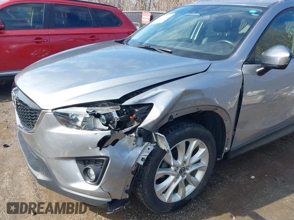 2014 Mazda CX-5 Grand Touring with VIN JM3KE2DY8E0375025, listed as a IAAI auction lot 41657755 with 103,601 mi miles. Bid and sale history available at carsss.com. Image 6.