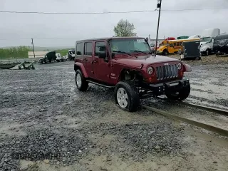 2007 Jeep Wrangler Unlimited Sahara with VIN 1J4GA59197L104784, listed as a Copart auction lot 56700205 with 156,382 mi miles and Salvage title. Bid and sale history available at DreamBid. Image 15.