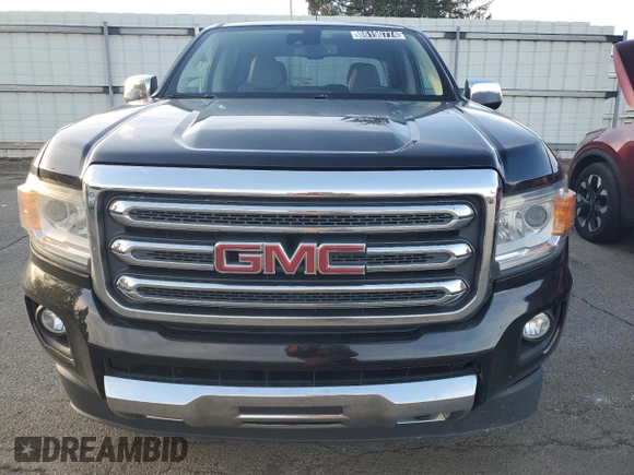 2015 GMC Canyon 4WD SLT z VIN 1GTG6CE34F1121540, wystawiony jako Copart lot #86190774 z przebiegiem 141 381 mil mil oraz Czysty tytuł • Clean title. Historia ofert i sprzedaży dostępna na DreamBid. Obrazek 5.